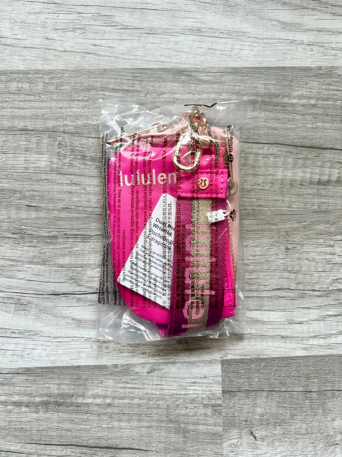 Lululemon Dual Pouch Wristlet Pink and Gold Wordmark New With Tags