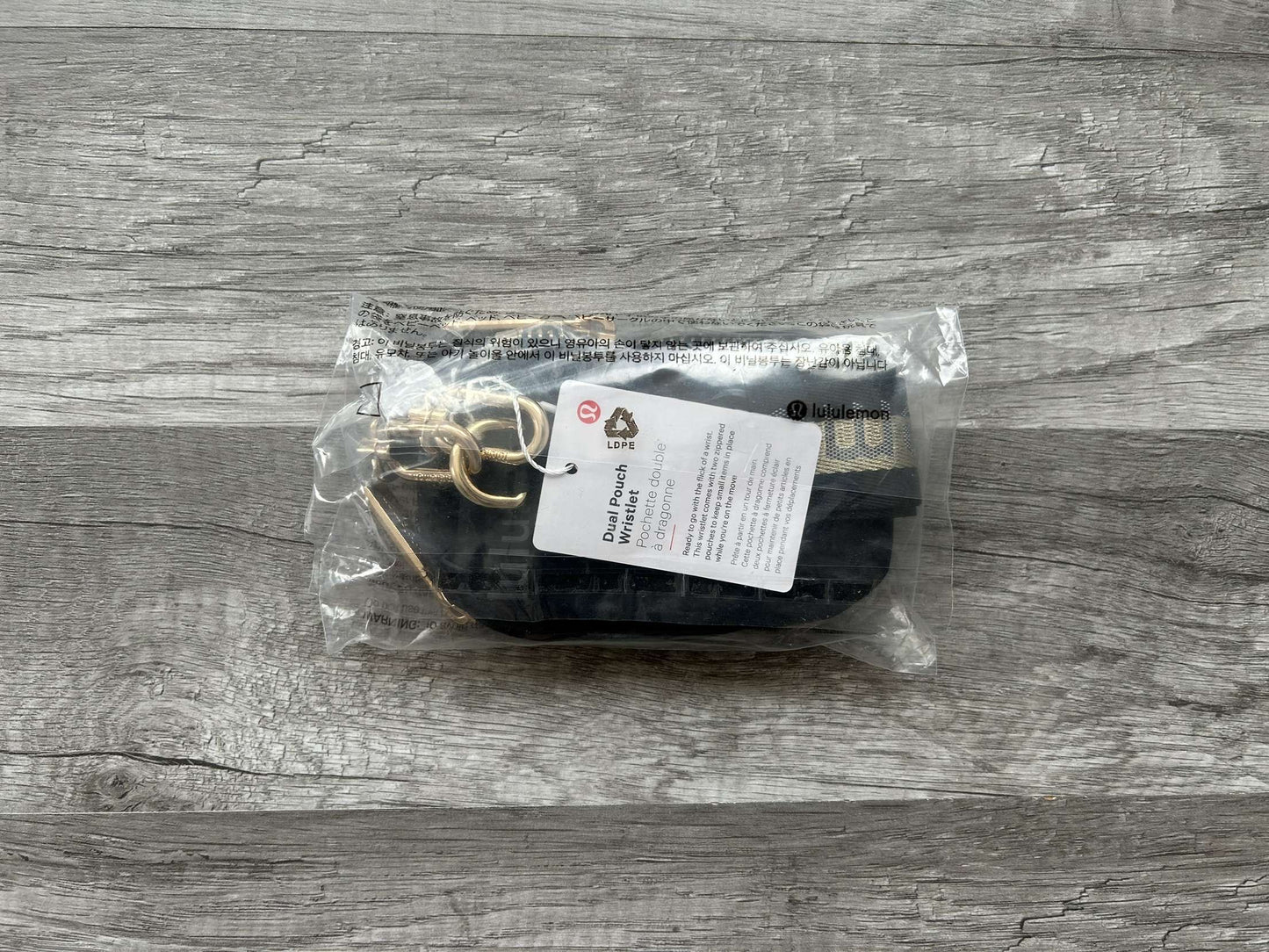 Lululemon Dual Pouch Wristlet Black and Gold Wordmark New With Tags
